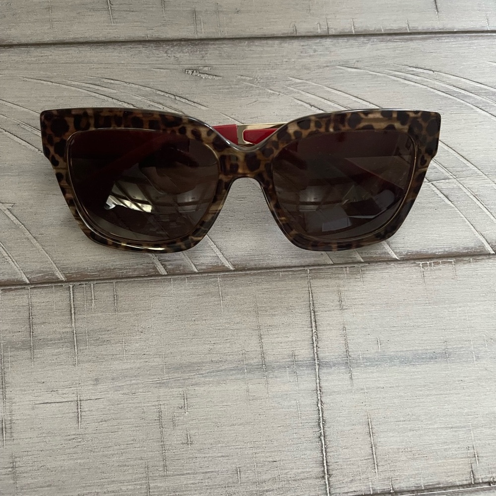 Micheal Kors 399773 54/18 leopard print frames with gold &red .